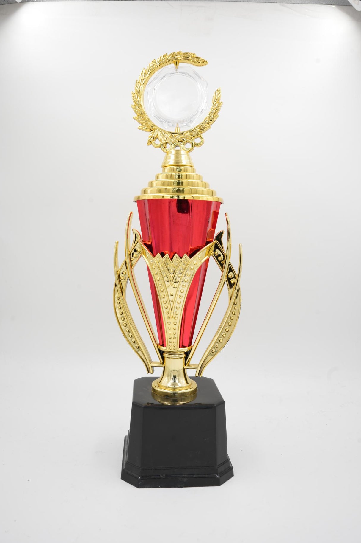 Elegant standard trophy with crescent moon top and wide black pedestal
