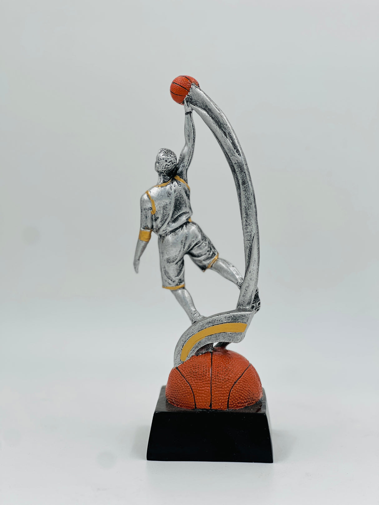 Dynamic silver basketball award for Dunk Champion or League MVP, capturing a mid-air leap and scoring action.