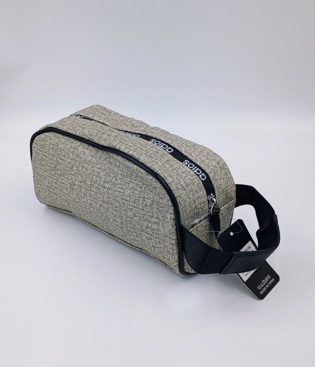 Durable, textured fabric zipper pouch in earthy tones, ideal for organizing travel toiletries or tech accessories.