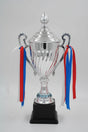 Silver championship trophy cup with lid and red and blue ribbons