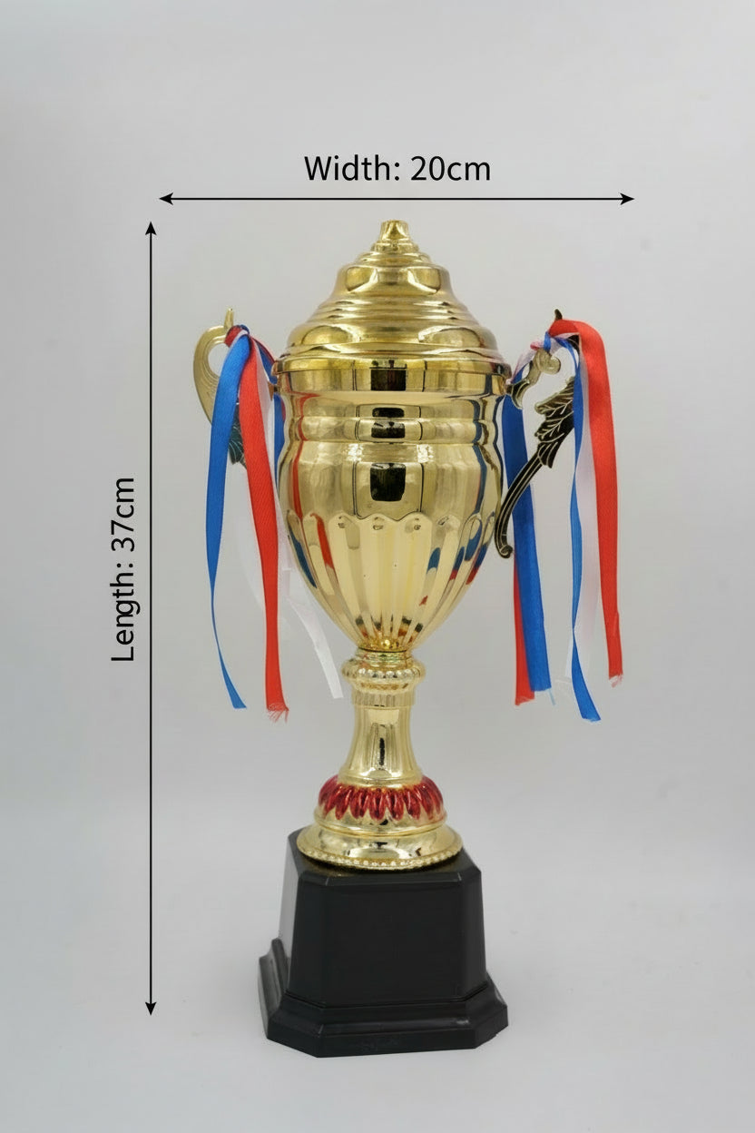 Large gold championship trophy cup with lid and red, white, and blue ribbons