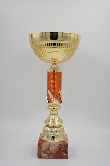 Wide gold sports award trophy with patterned central post for events