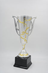 Unique silver cup award with detailed gold trim for competitions