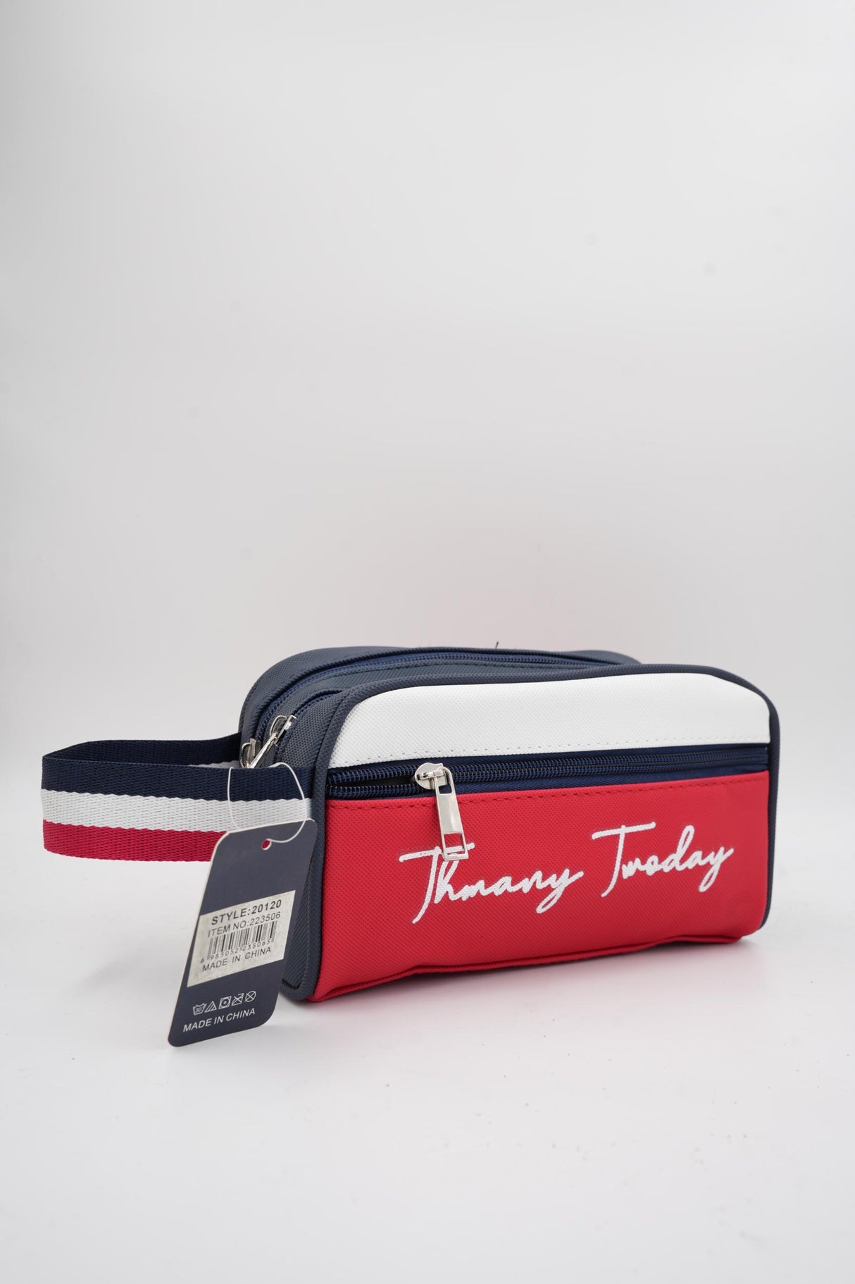 Red, white, and blue Tommy Today branded pouch with wrist strap and zipper
