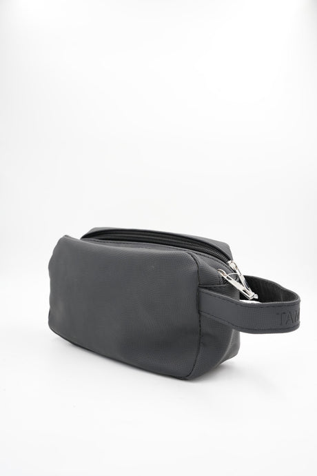 Compact cosmetic or shaving bag in black, side view with handle