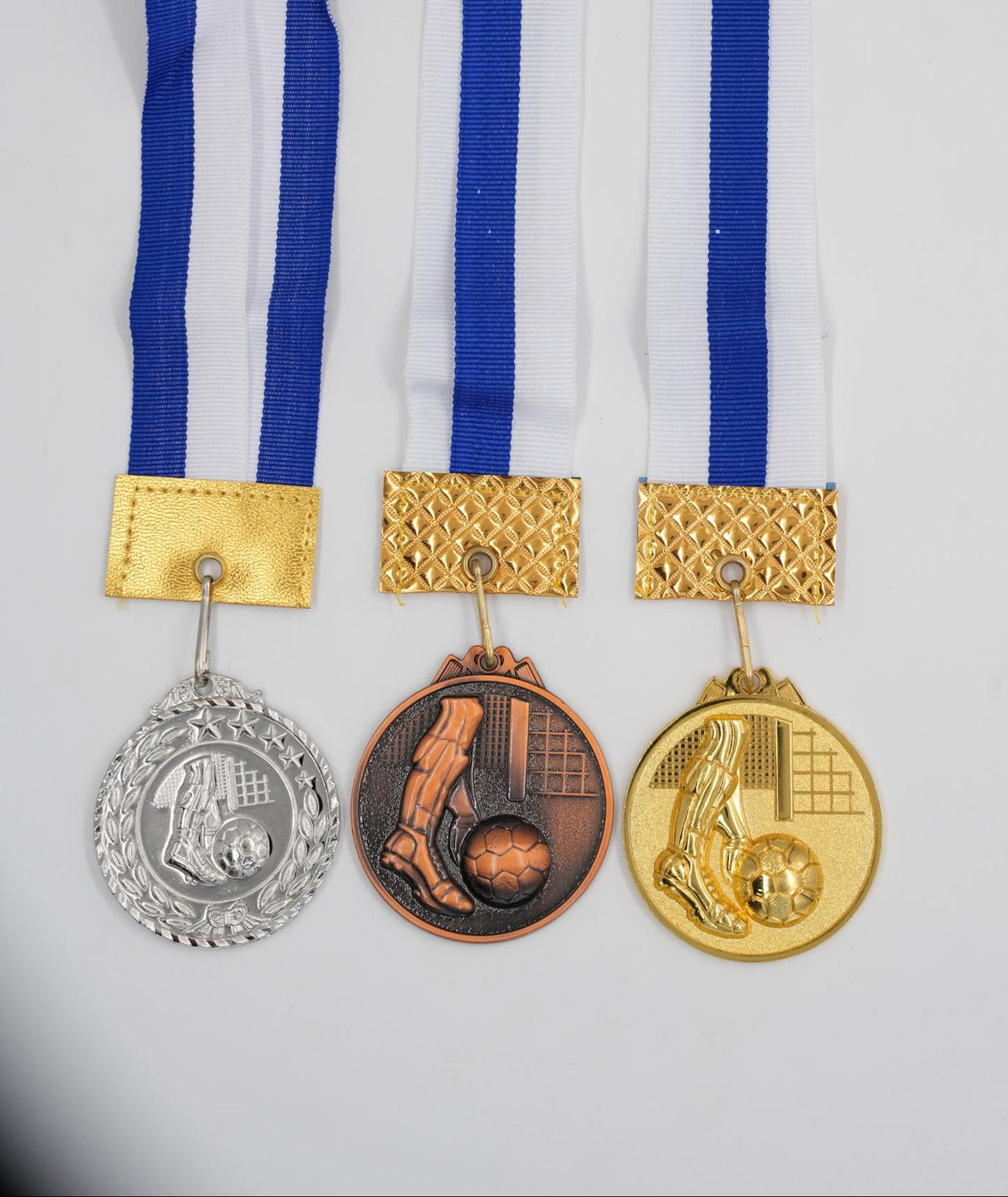 Set of 3 football medals gold silver bronze with blue and white ribbon