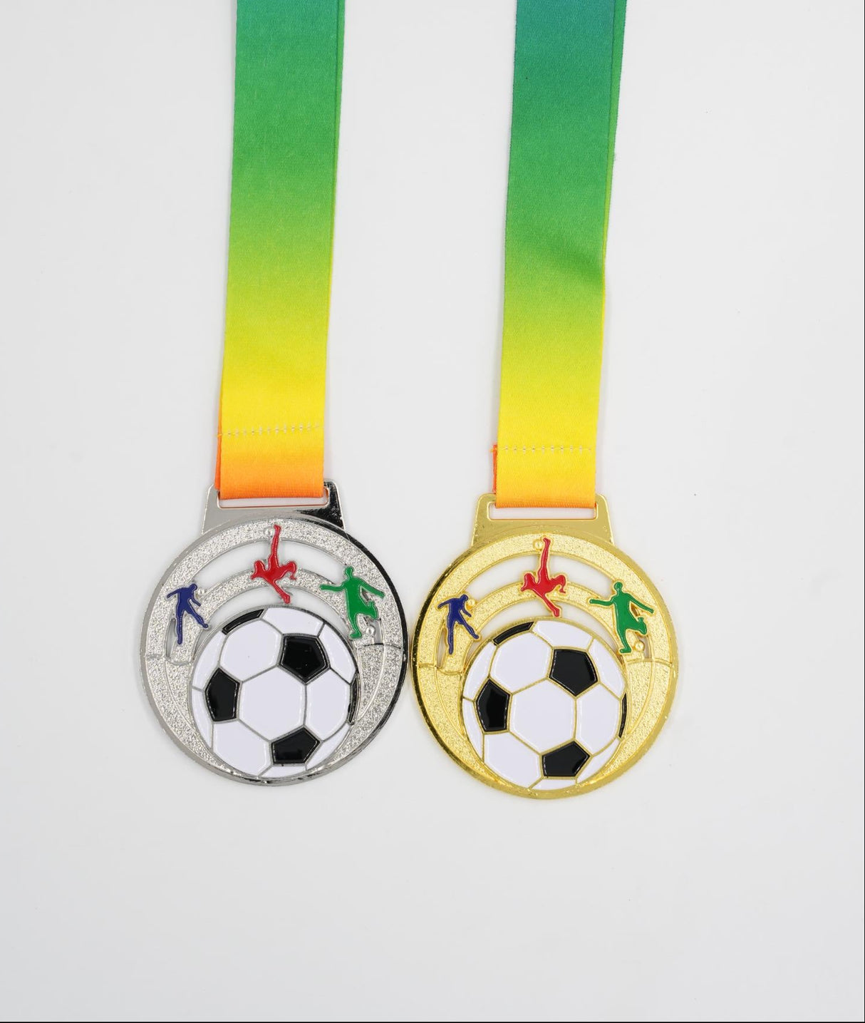 Gold and silver kids football medals with colorful celebrating figures