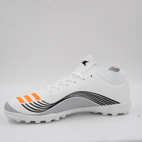 Side view of a white turf football shoe featuring orange stripes, dynamic black line details, and a rubber studded outsole designed for artificial grass.