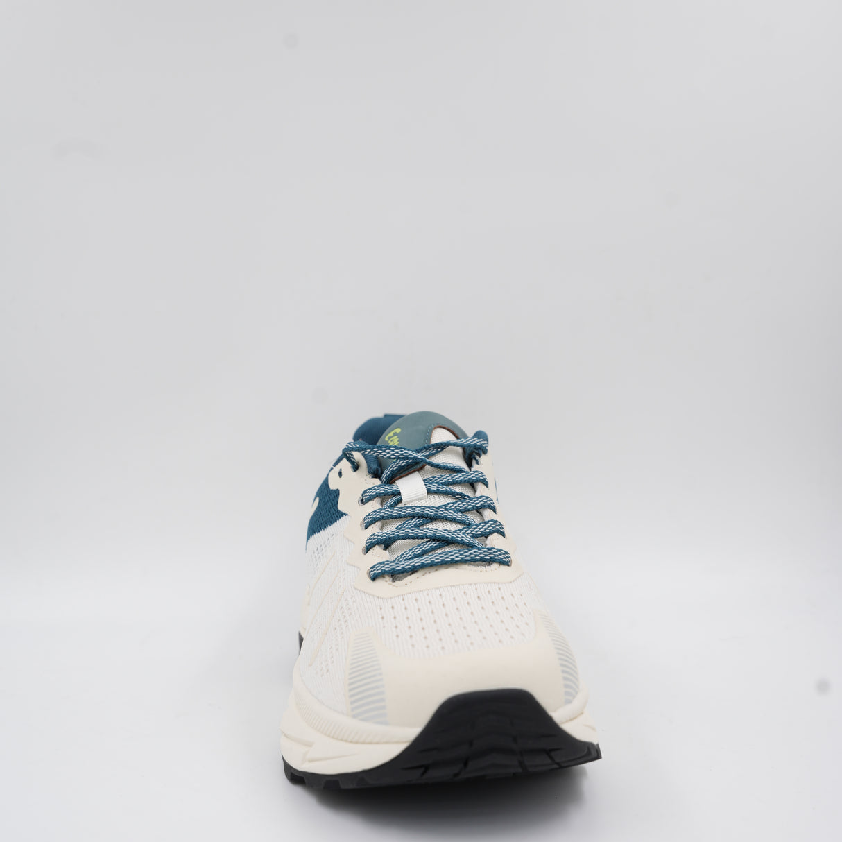 Close-up front angle of the white and teal Ecowalk athletic shoe showing the sturdy lace-up system and textured toe area.