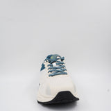 Close-up front angle of the white and teal Ecowalk athletic shoe showing the sturdy lace-up system and textured toe area.