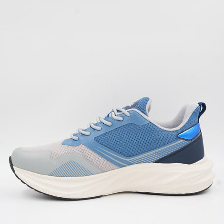 Back angle of the Ecowalk chunky sneaker highlighting the thick shock-absorbing sole, navy blue heel details, and a convenient pull tab.