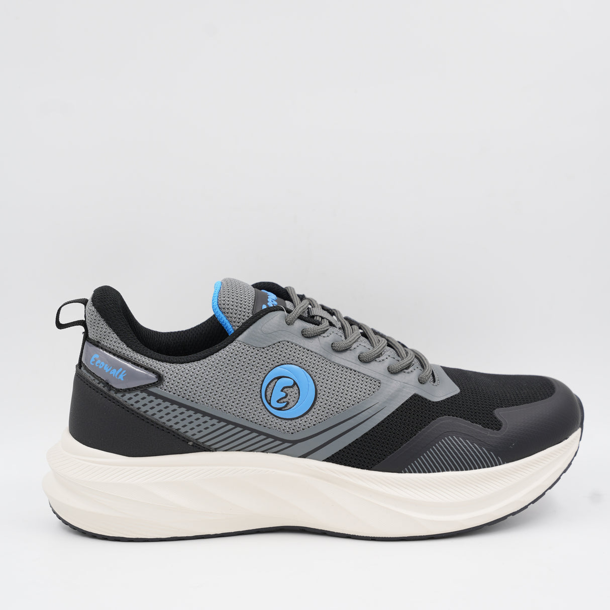 Side view of the Ecowalk men's walking sneaker in grey and black with blue accents, featuring a thick cushioned off-white sole.