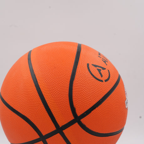 Classic orange outdoor basketball showing deep black channels designed for perfect ball control on street courts.