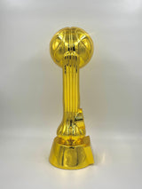 Shiny metallic gold trophy featuring a basketball atop an elegant support column.