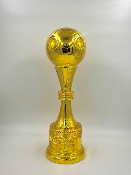 Tall, ornate gold trophy with a smooth ball top on a white background.