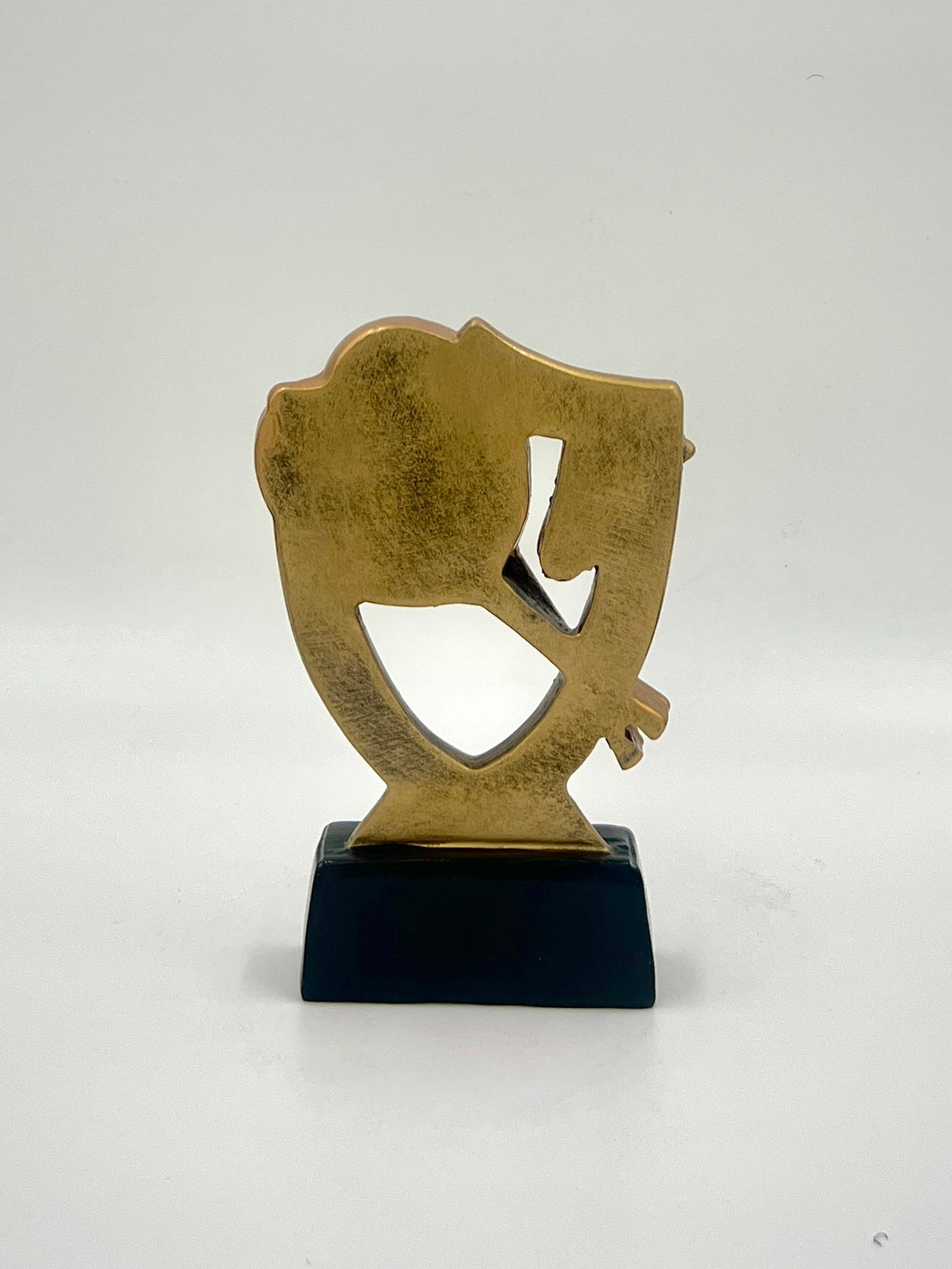 Racket sports award with an antique bronze finish and a sleek black display stand.