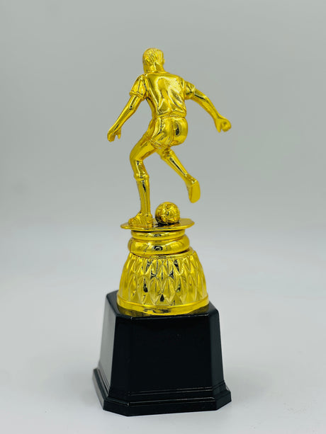 Detailed gold football award figure in a dynamic kicking pose, ideal for league MVP, top goal scorer, or tournament winner recognition.