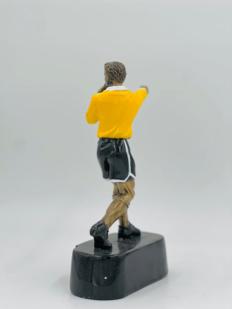 Shining gold award for cricket champion or league winner, displaying iconic stumps, bat, and ball motif.