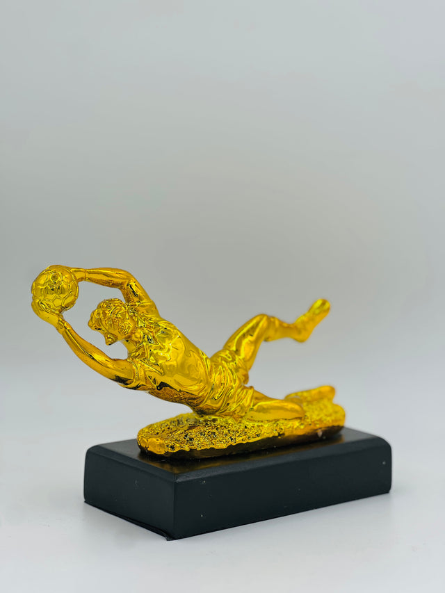 Stunning gold football trophy—perfect for honoring match-winning saves, heroic tackles, and exceptional defensive play.