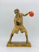 Detailed bronze basketball award for top scorer or MVP, capturing the intensity of a mid-game maneuver.