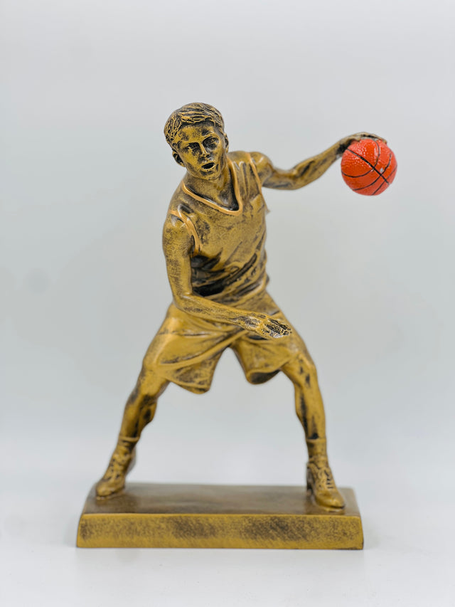Detailed bronze basketball award for top scorer or MVP, capturing the intensity of a mid-game maneuver.