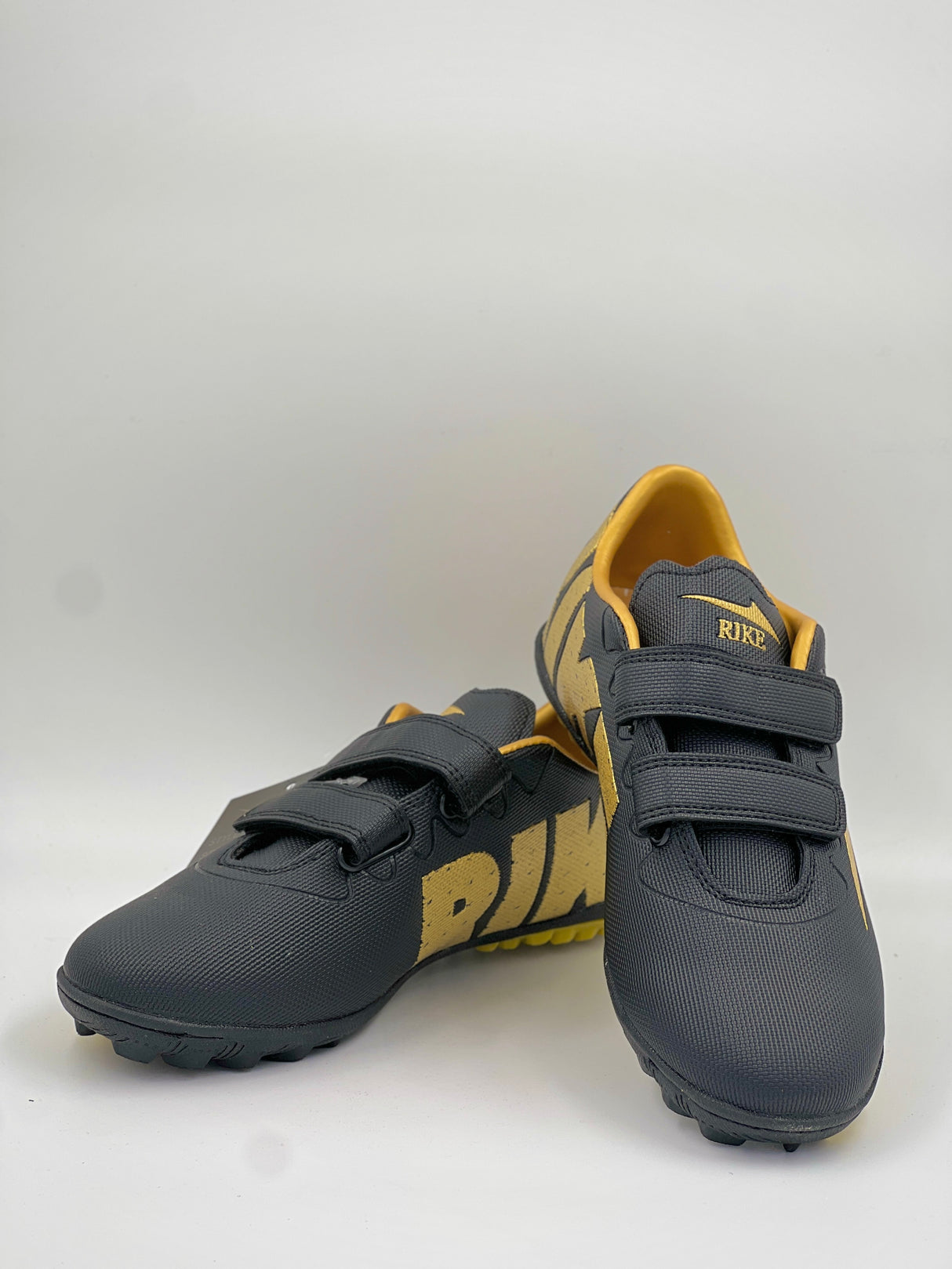 High-performance black and gold Rike training footwear