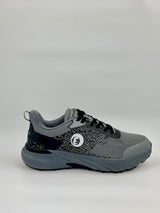 Gray and black athletic shoe on a light gray background