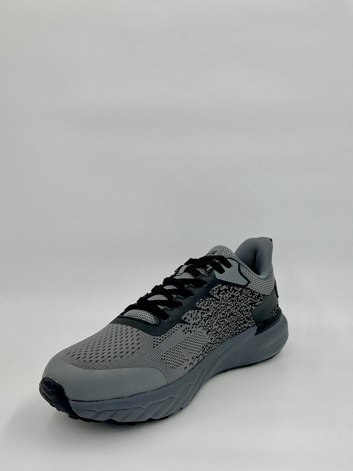 Gray athletic shoe on a light gray background