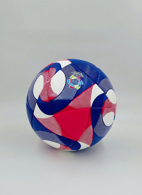 Colorful soccer ball with geometric pattern on a gray background