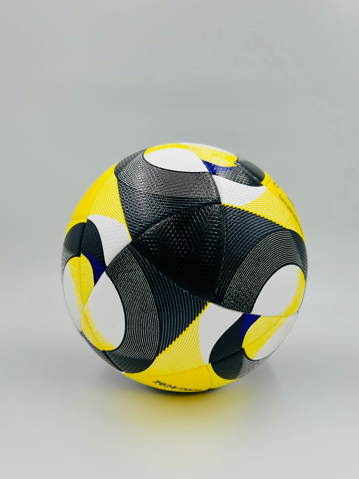 Multicolored soccer ball on a gray background