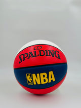 Red, blue, and white Spalding NBA basketball on a light gray background