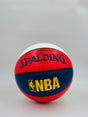 Red, blue, and white Spalding NBA basketball on a light gray background