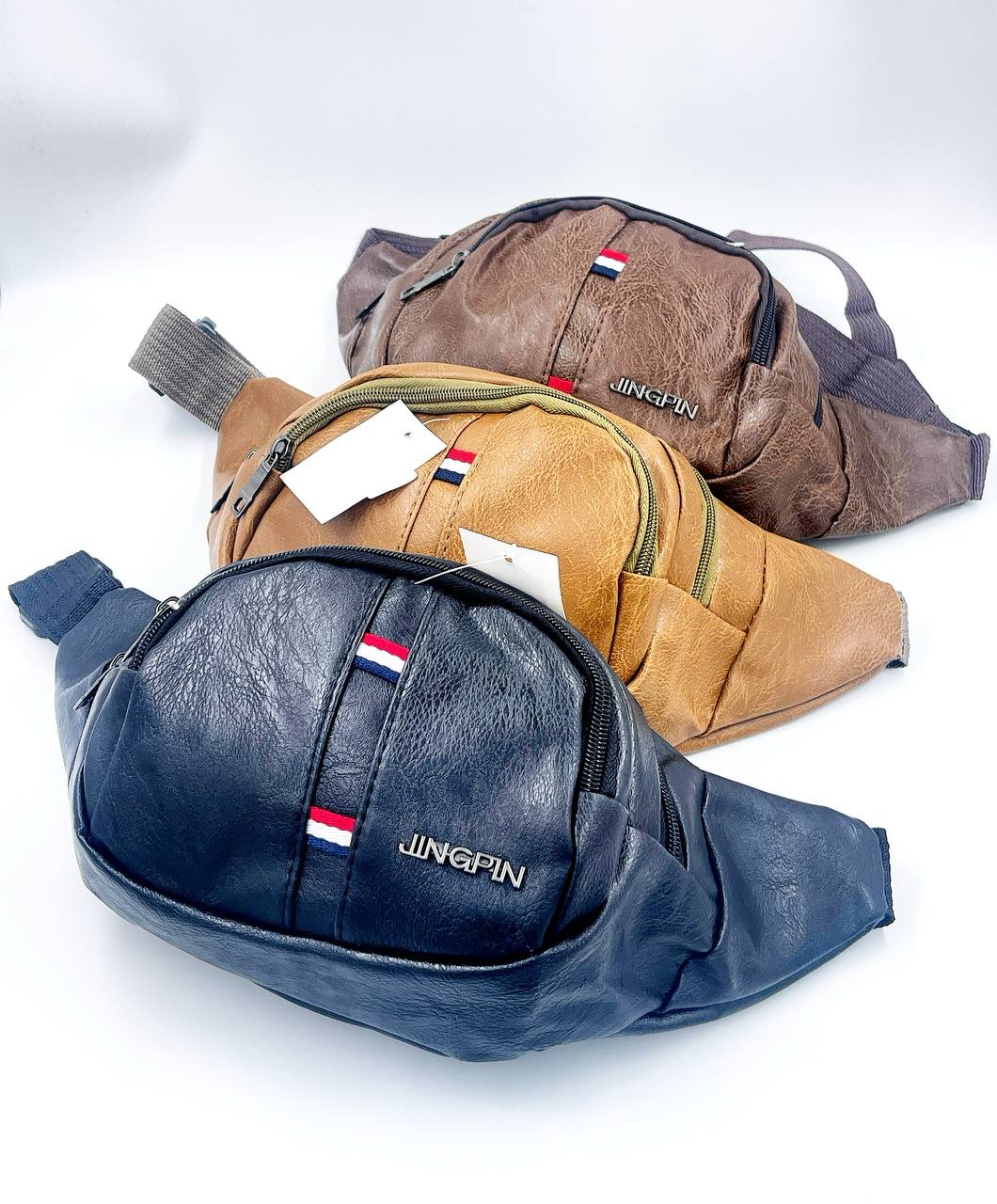 Set of three leather-look waist bags (fanny packs) in black, brown, and tan with visible logo, worn for travel or running.
